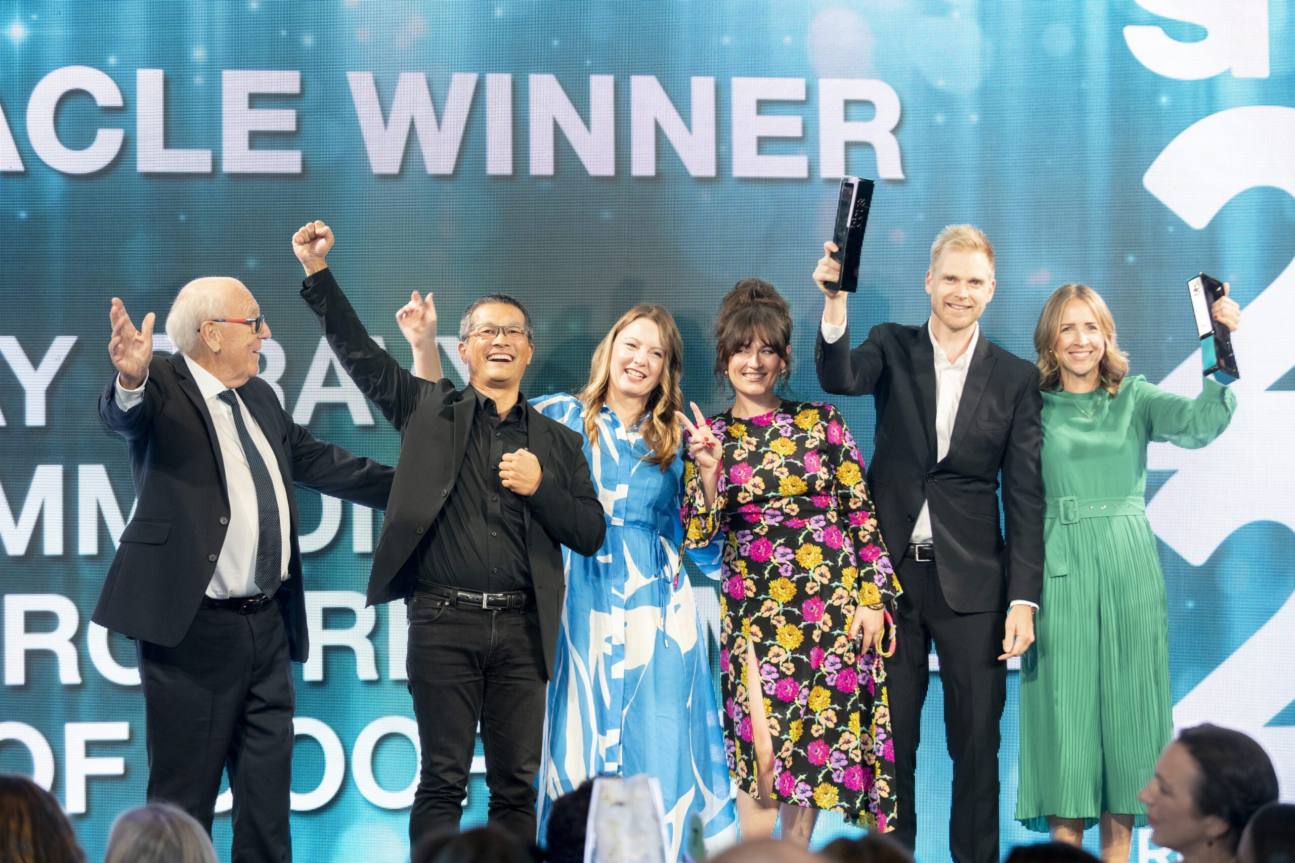 3 women and 2 men accept Tom Harris Best In show award for Shop! ANZ